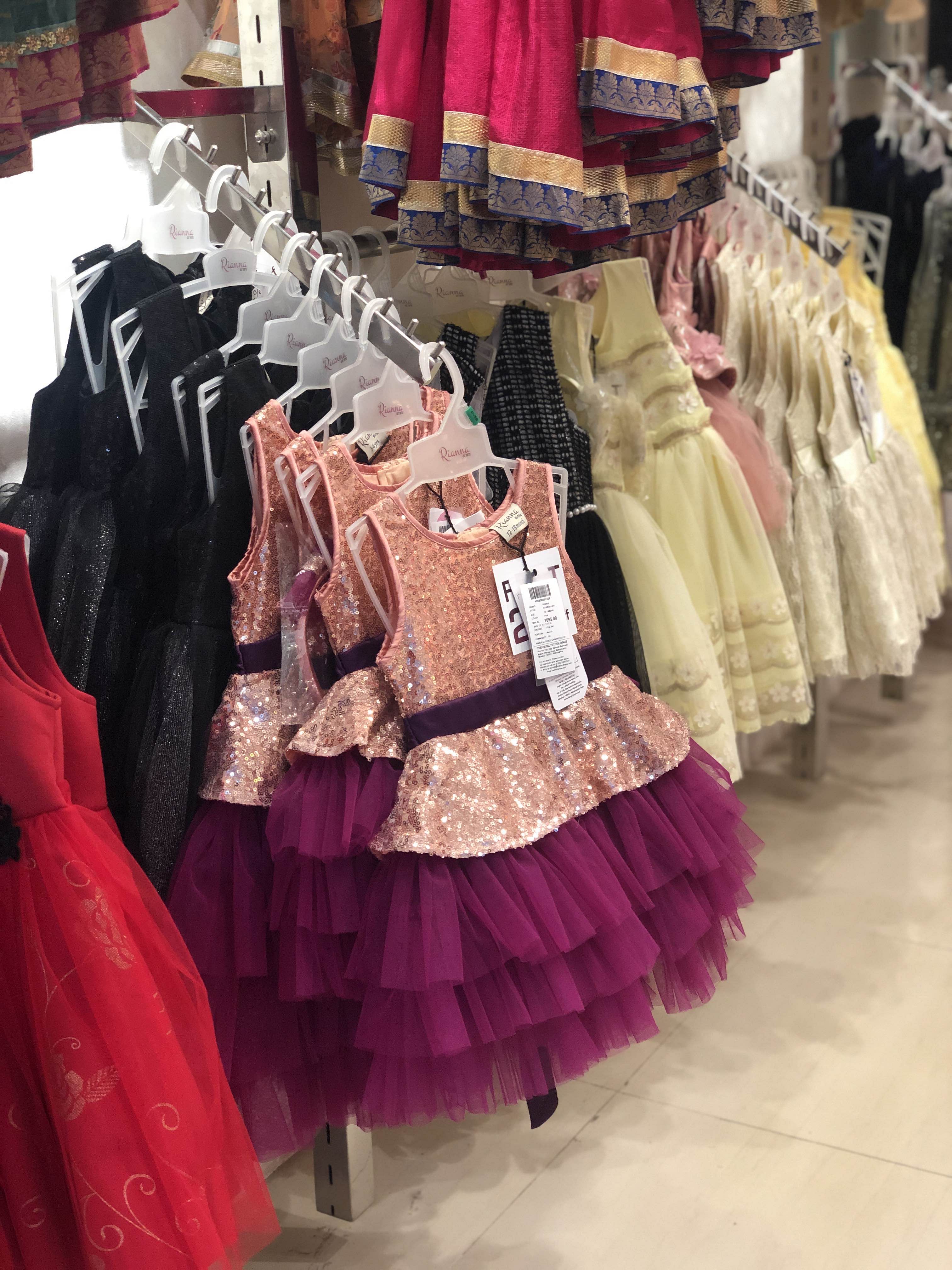 Clothing,Pink,Boutique,Dress,Fashion,Textile,Costume design,Outlet store,Magenta,Fashion design