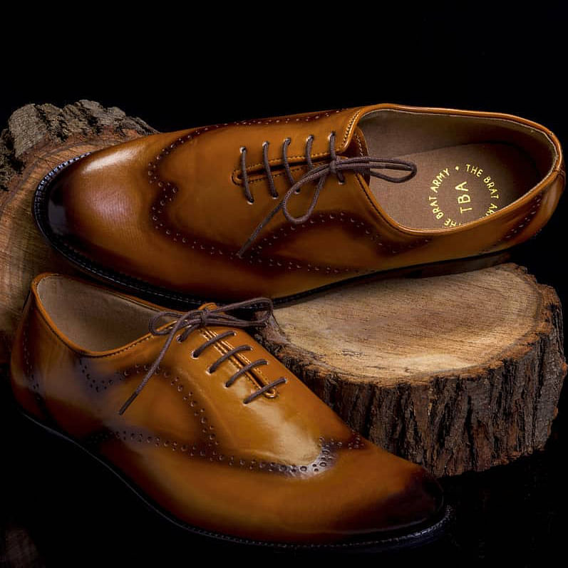 Footwear,Tan,Shoe,Brown,Oxford shoe,Dancing shoe,Caramel color,Beige,Still life photography