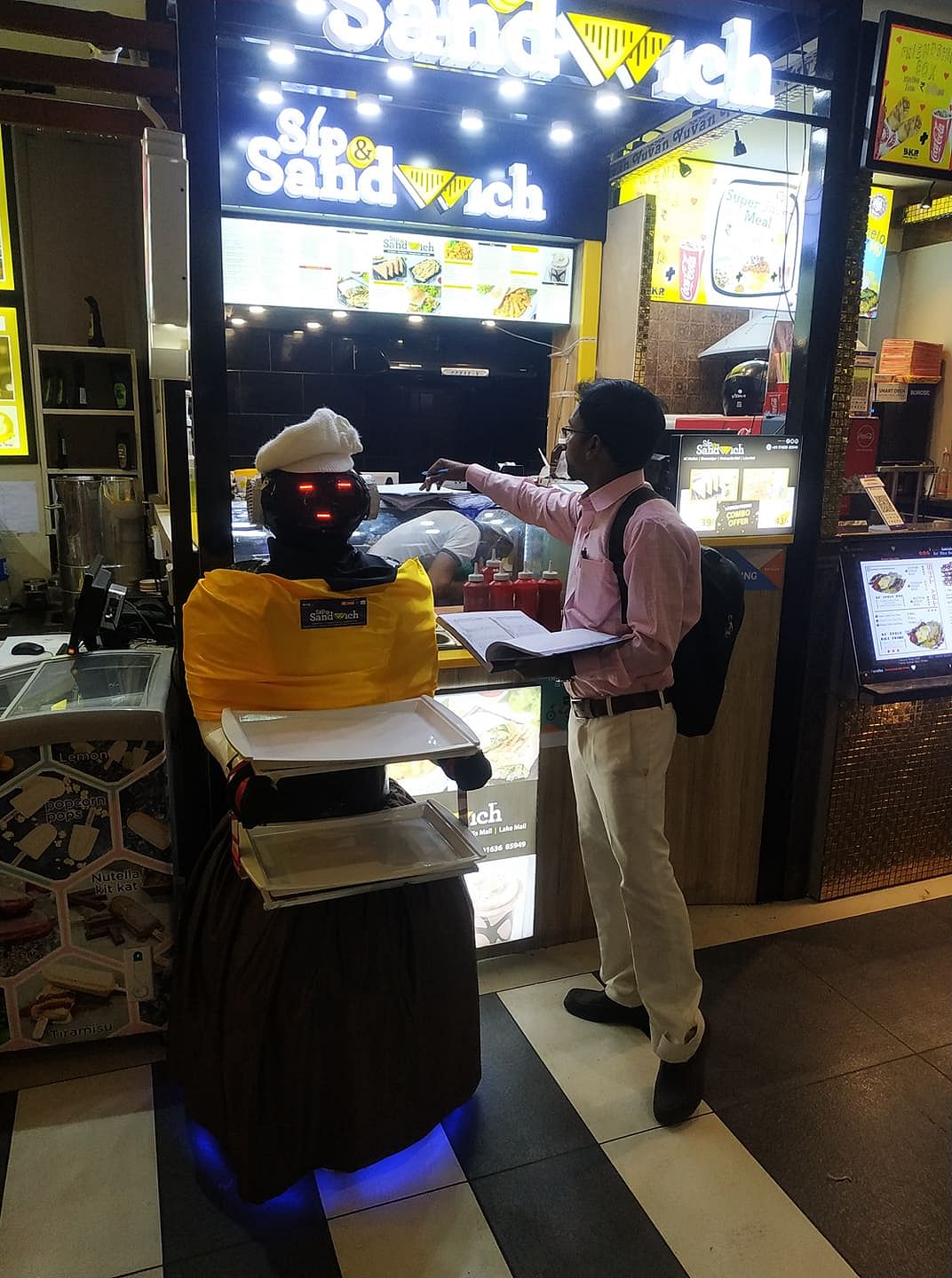 Yellow,Games,Fast food restaurant,Technology,Electronic device,Machine,Recreation,Fast food,Arcade game,Tourism