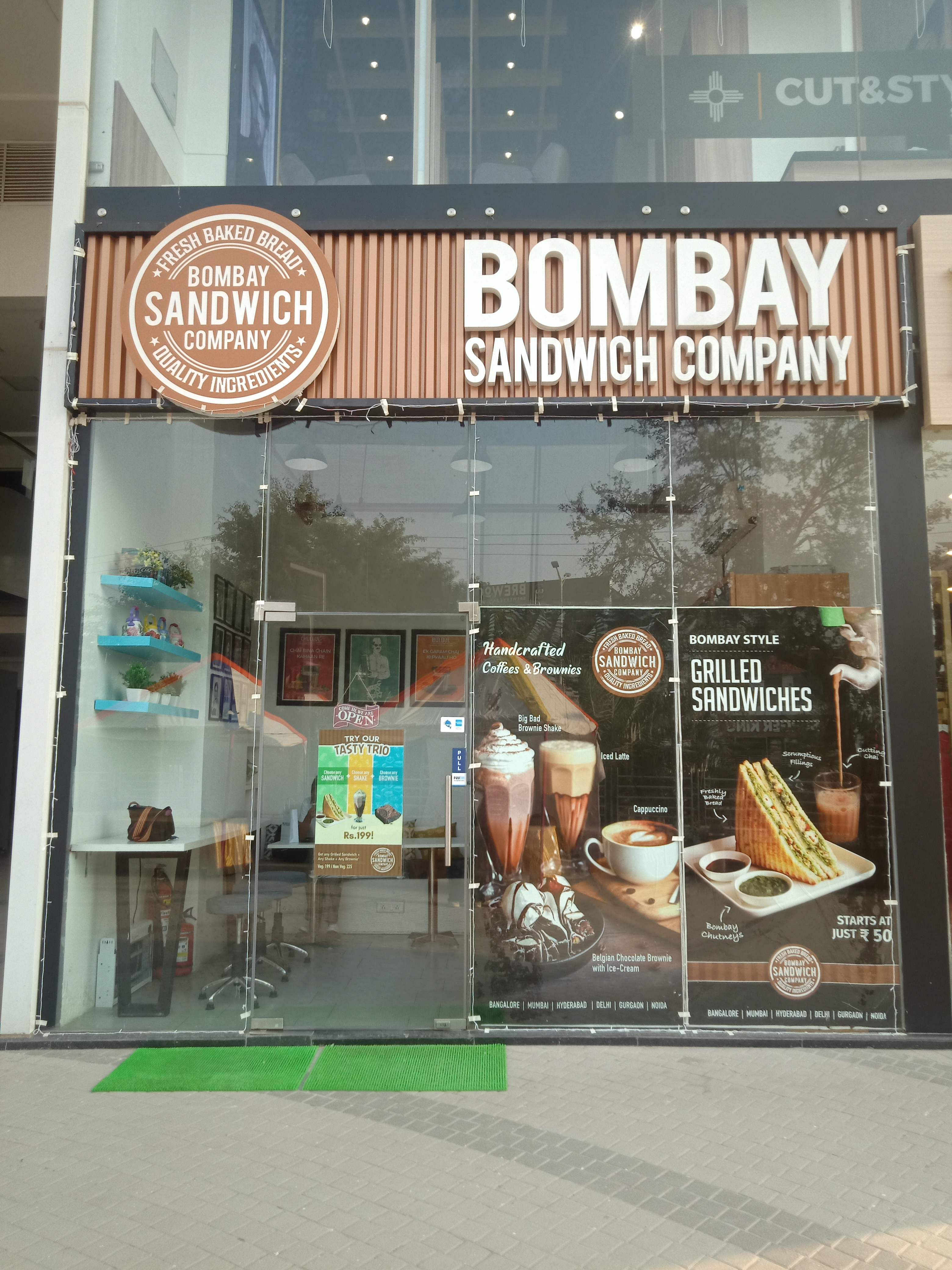 Building,Display window,Bakery,Display case,Advertising,Window,Snack,Food,Signage