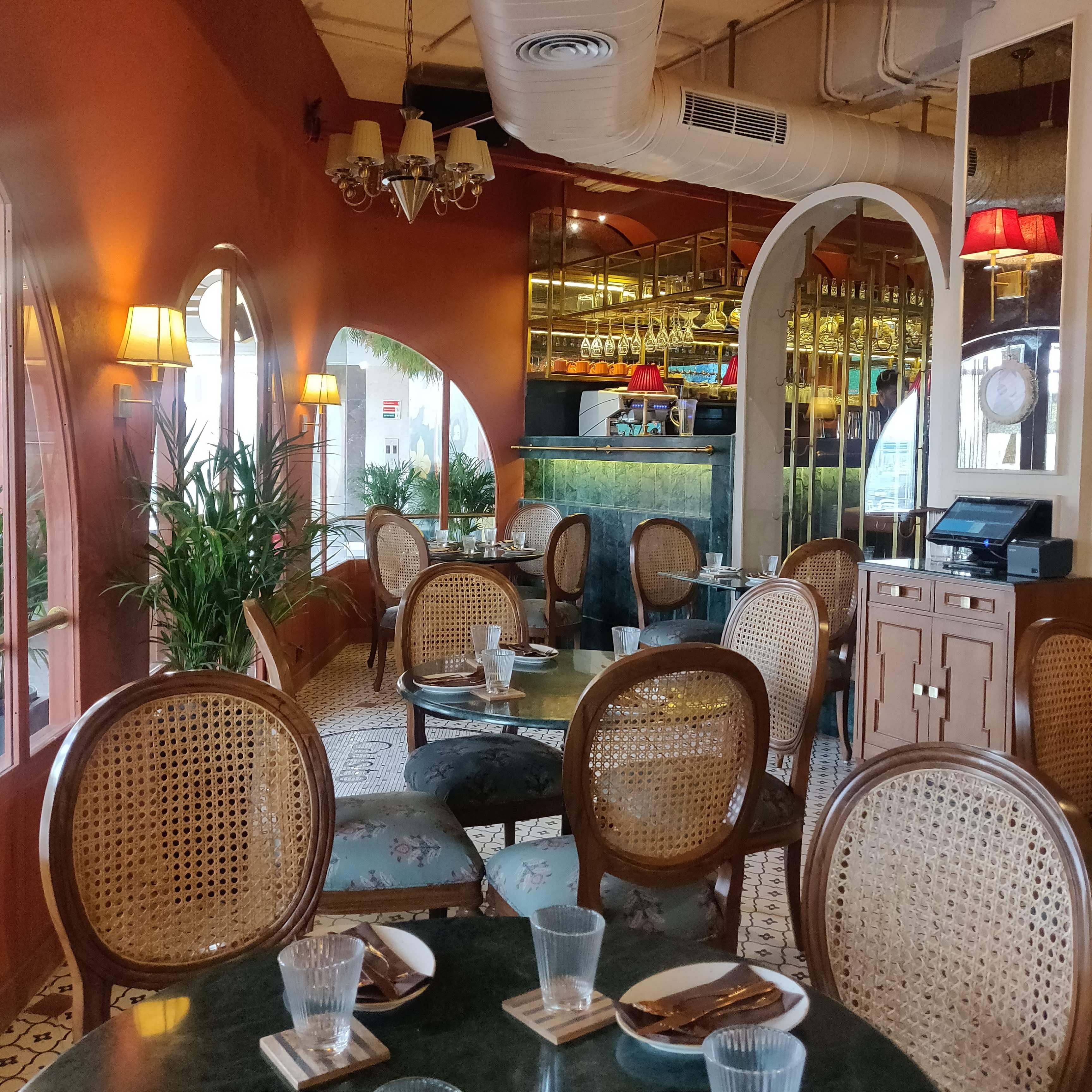 Restaurant,Furniture,Building,Table,Coffeehouse,Interior design,Chair,Café,Wicker,Leisure