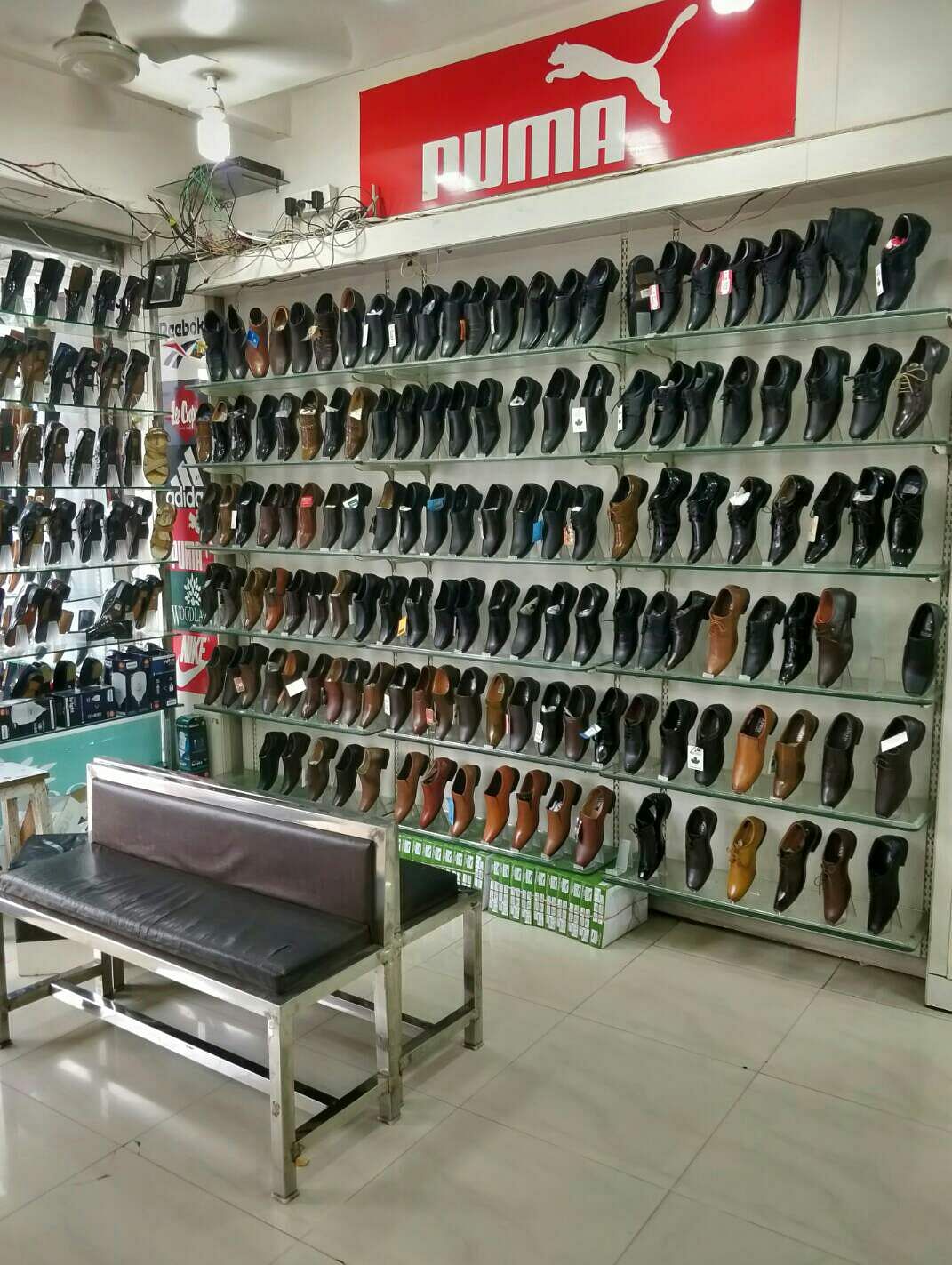 Shoe store,Footwear,Building,Outlet store,Retail,Shoe,Eyewear,Room,Shelf,Furniture