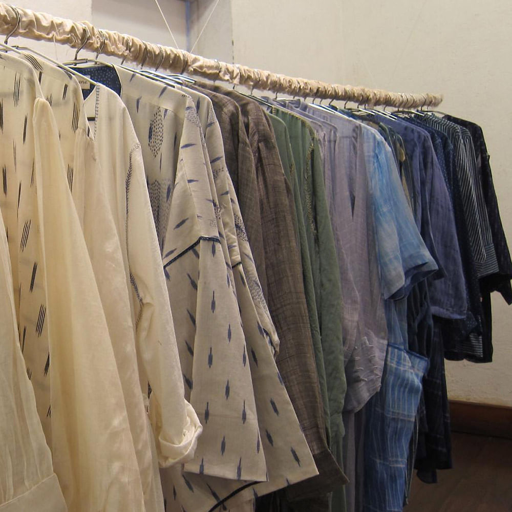 Clothing,Clothes hanger,Room,Textile,Linens,Boutique,Home accessories,Furniture,Laundry,Tablecloth