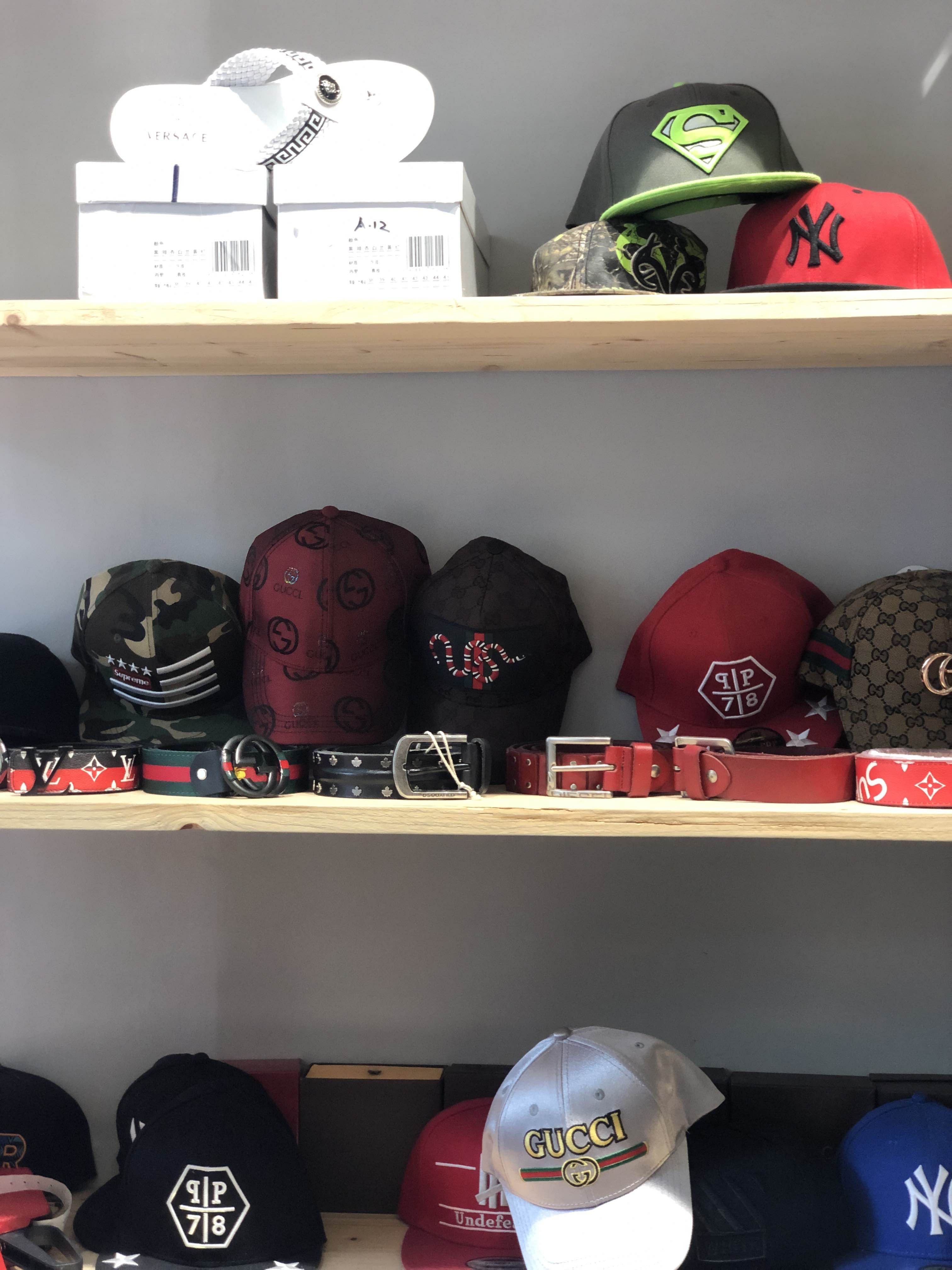 Shelf,Cap,Shelving,Headgear,Room,Helmet,Furniture,Personal protective equipment,Hat,Fashion accessory