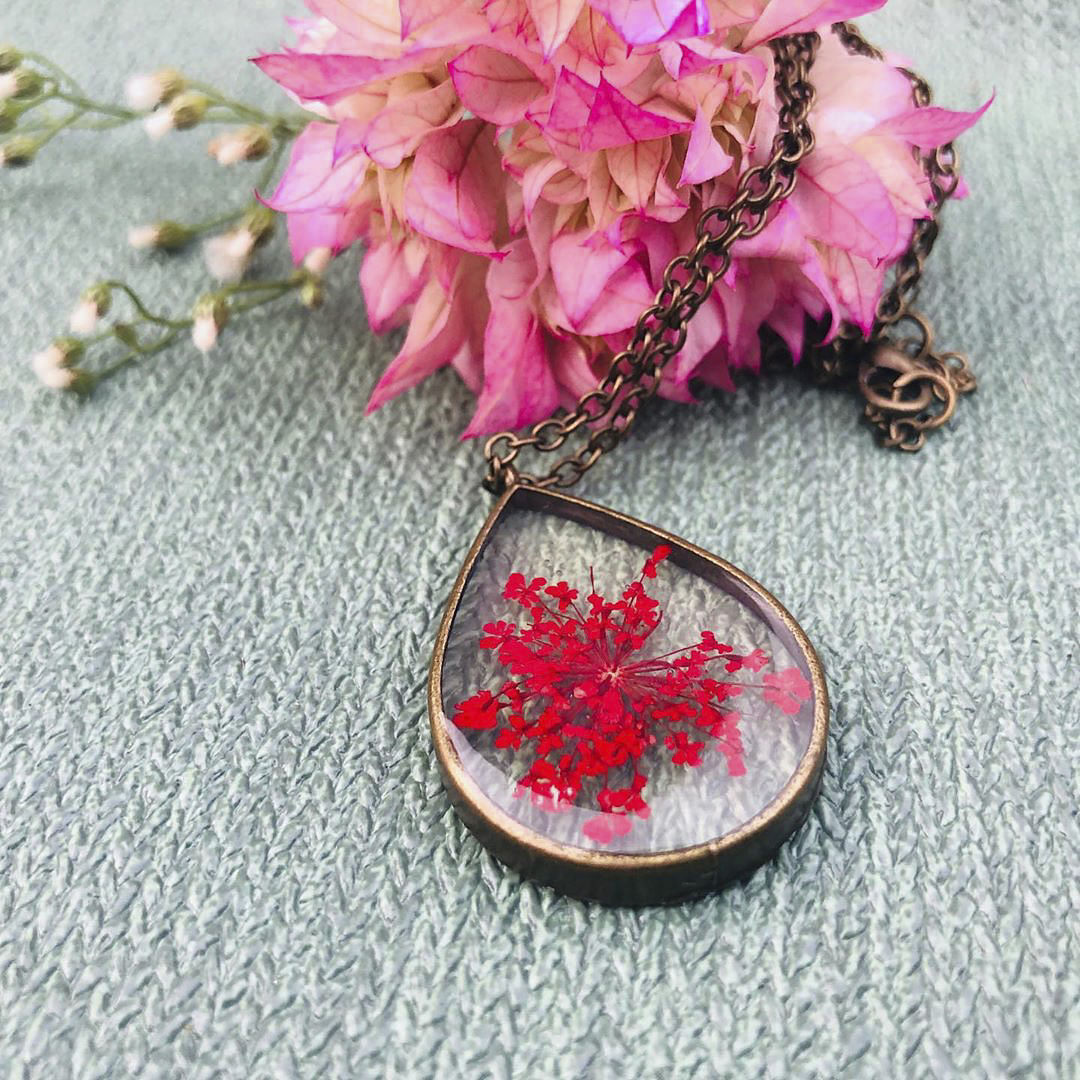 Leaf,Pink,Tree,Maple leaf,Plant,Pendant,Flower,Woody plant,Fashion accessory,Brooch