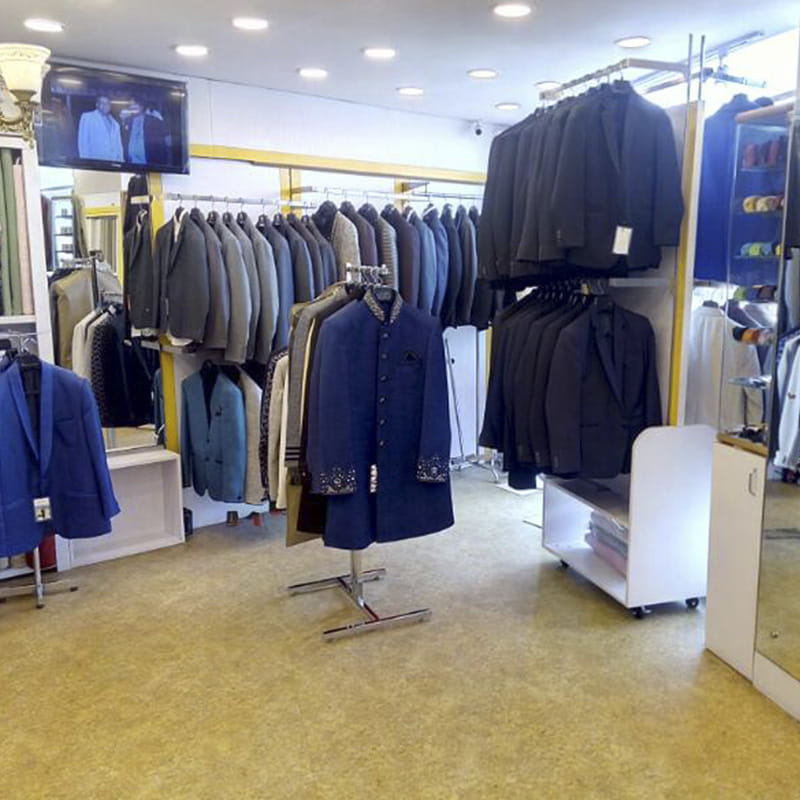 Boutique,Clothing,Outlet store,Fashion,Room,Suit,Retail,Outerwear,Building,Dry cleaning