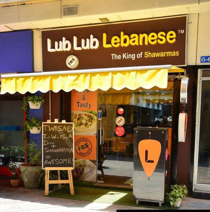 Building,Outlet store,Fast food restaurant,Signage,Fast food,Awning,Mediterranean food