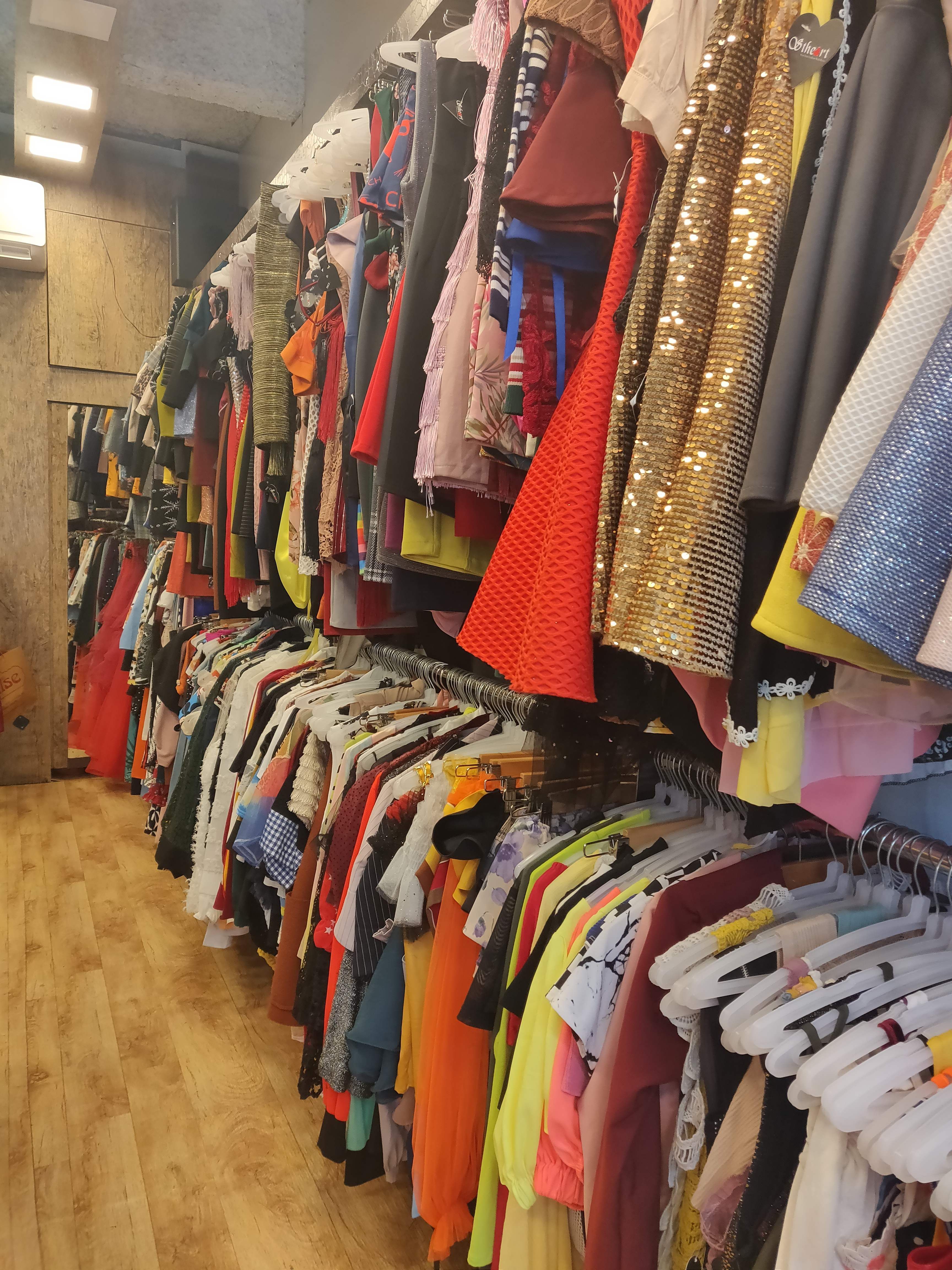 Boutique,Clothing,Room,Outlet store,Closet,Textile,Bazaar,Clothes hanger,Outerwear,Retail