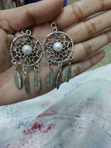 Jewellery,Fashion accessory,Body jewelry,Hand,Finger,Earrings,Silver,Turquoise,Pearl,Gemstone