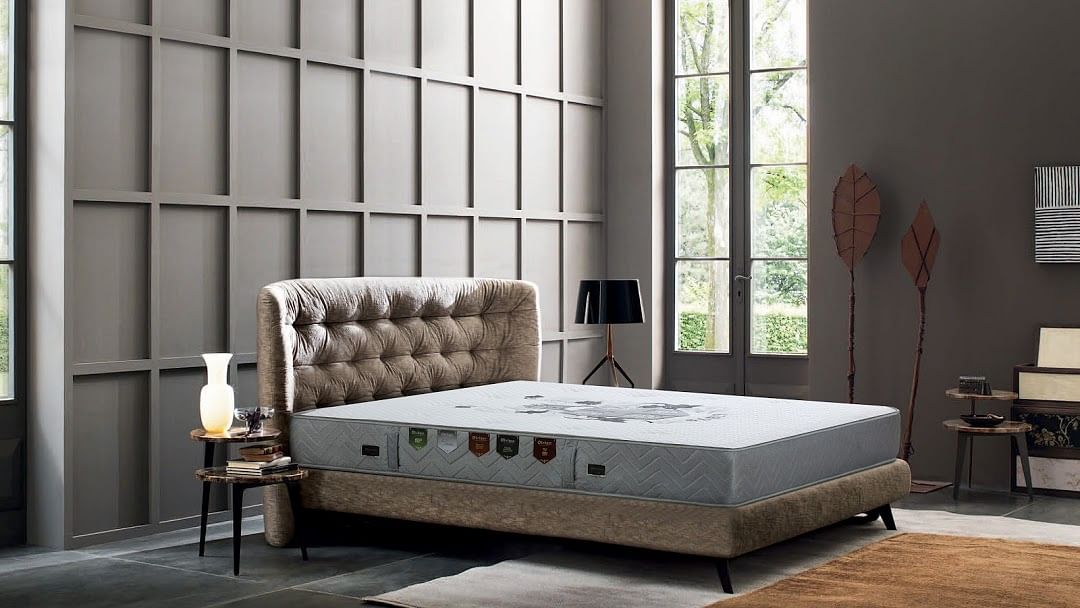 Furniture,Bed,Mattress,Bed frame,Bedroom,Room,Interior design,Table,Nightstand,Couch