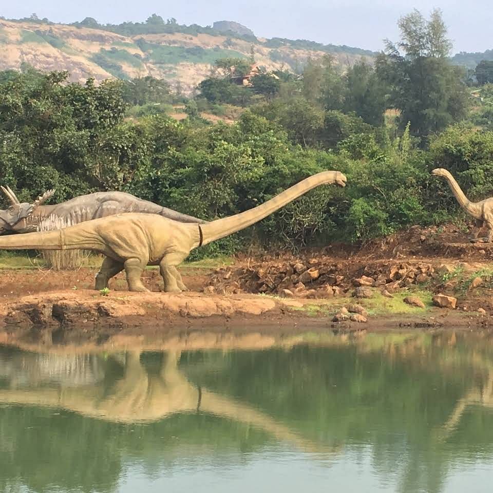 Dinosaur,Water,Water resources,Bank,Nature reserve,Vegetation,Wildlife,Terrestrial animal,Natural landscape,Natural environment