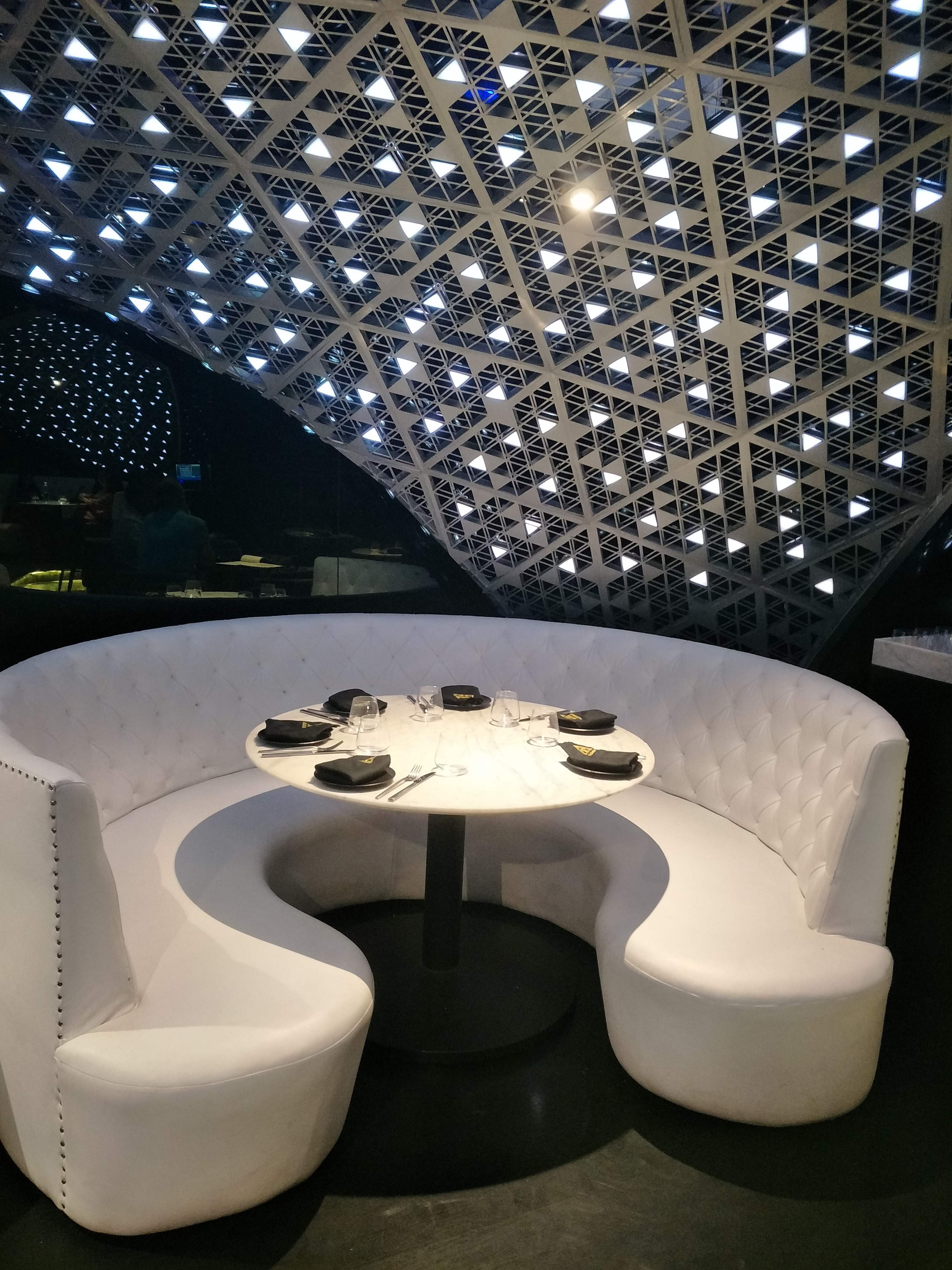 Architecture,Interior design,Lighting,Table,Furniture,Design,Ceiling,Automotive design,Coffee table,Room