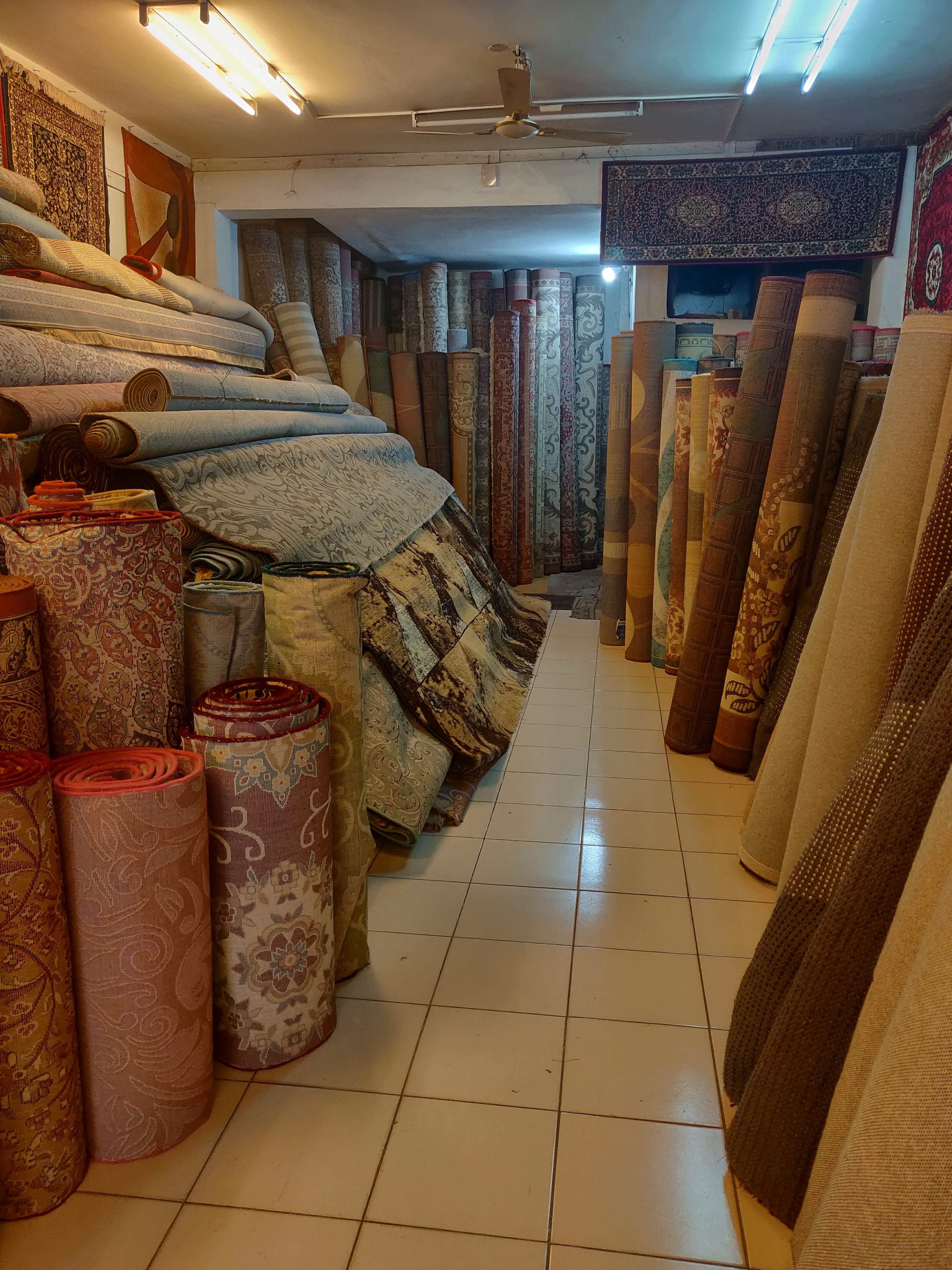 Room,Floor,Interior design,Flooring,Textile,Ceiling,Building,Boutique,Furniture,Basement