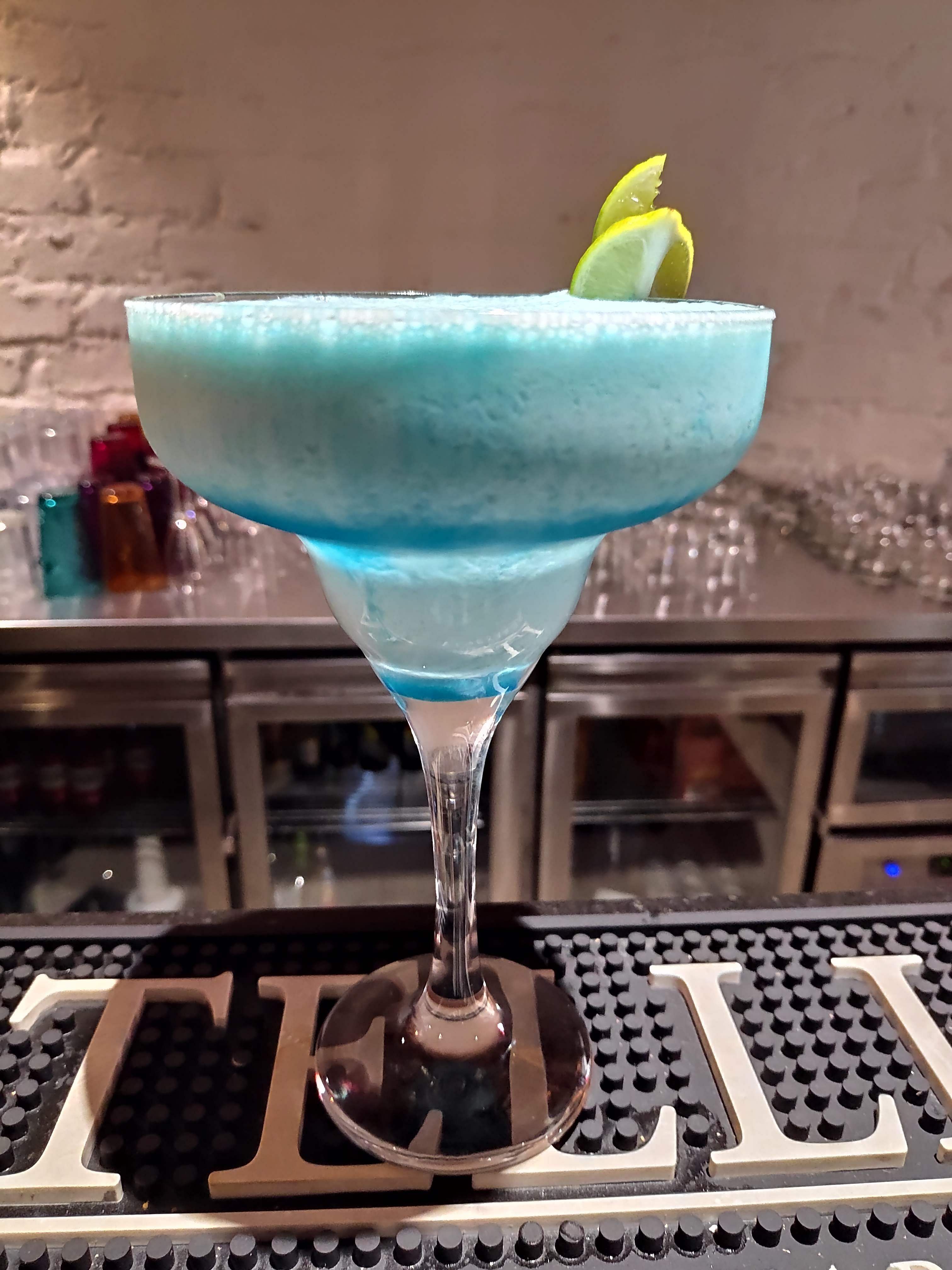 Drink,Martini glass,Blue hawaii,Distilled beverage,Alcoholic beverage,Cocktail garnish,Blue lagoon,Non-alcoholic beverage,Hpnotiq,Cocktail