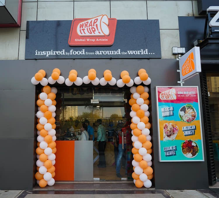 Architecture,Balloon,Arch,Orange,Party supply,Vegetarian food,Snack,Advertising