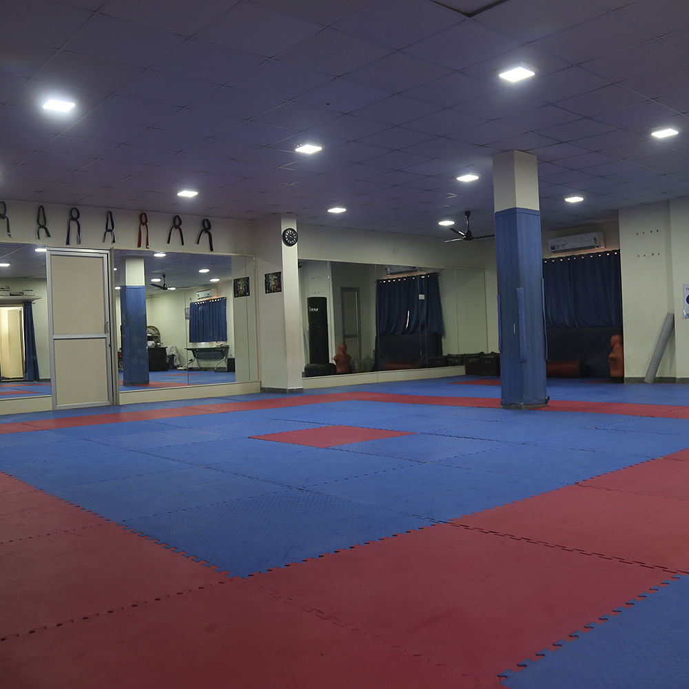 Blue,Mat,Martial arts,Sport venue,Room,Individual sports,Contact sport,Floor,Karate,Taekwondo