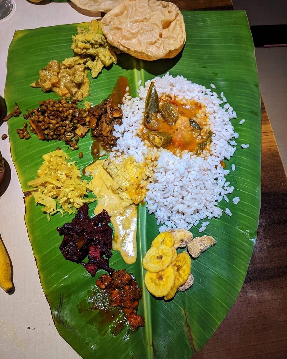 Dish,Food,Banana leaf,Sadya,Banana leaf rice,Leaf,Cuisine,Rice,Andhra food,Ingredient