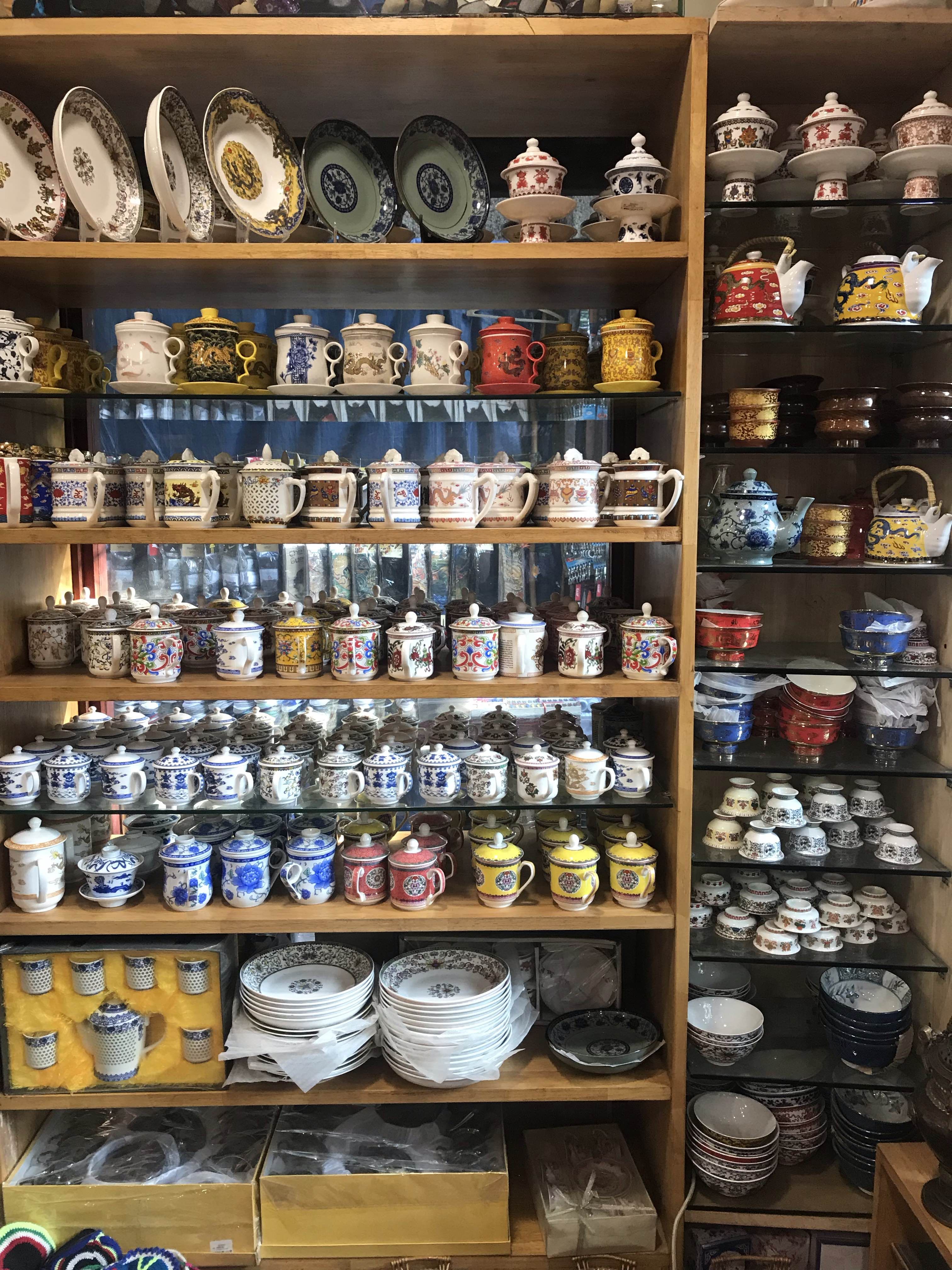 Collection,Shelf,Helmet,Room,Porcelain,Furniture,Tableware,Personal protective equipment