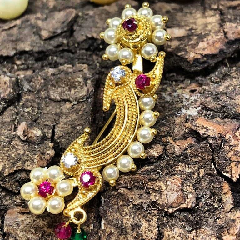 Jewellery,Fashion accessory,Brooch,Body jewelry,Gemstone,Pearl,Gold,Ruby,Bangle,Pendant