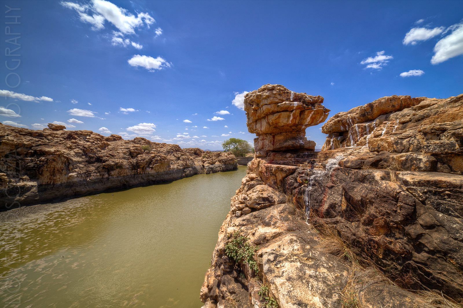 Rock,Nature,Natural landscape,Water resources,Sky,Water,Formation,Waterway,River,Cloud