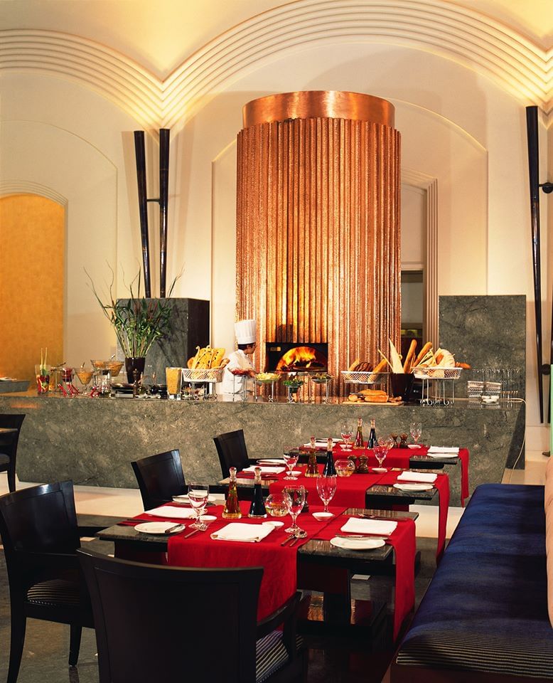 Room,Restaurant,Interior design,Property,Building,Furniture,Lighting,Table,Ceiling,Architecture