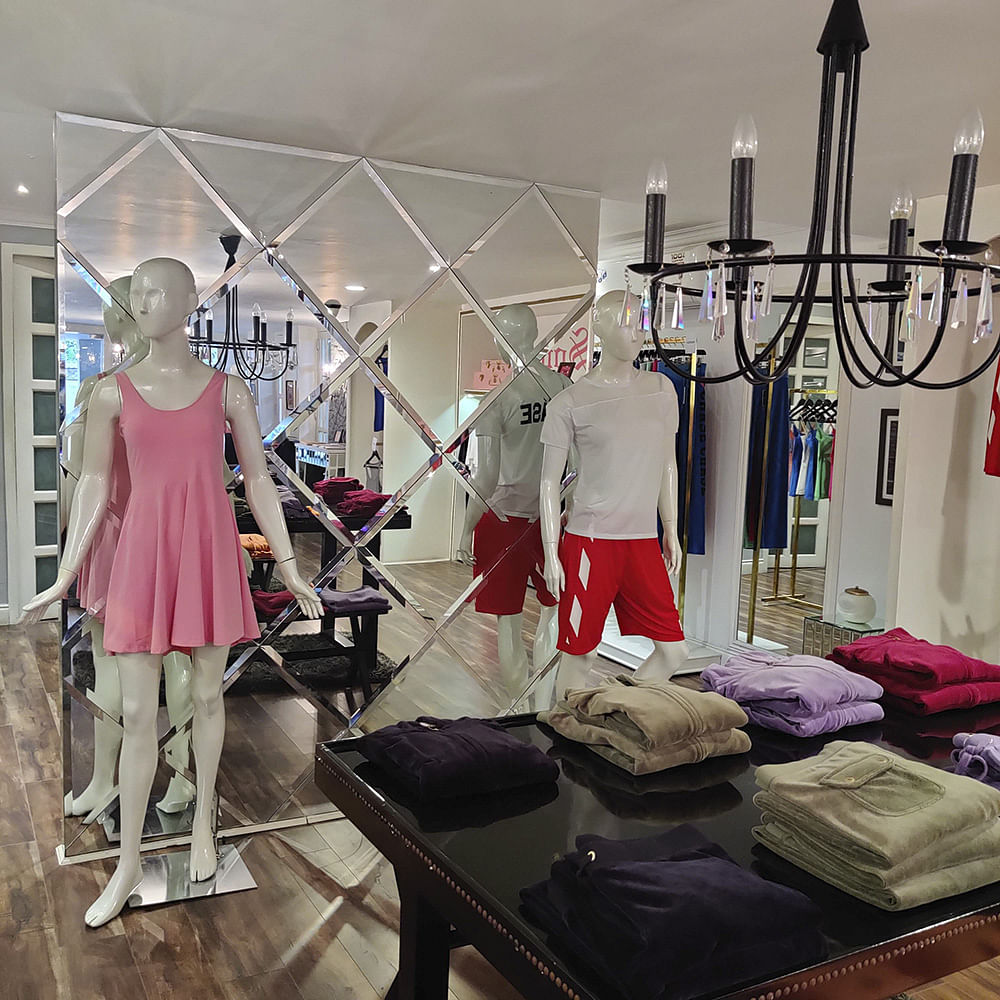 Boutique,Room,Fashion,Interior design,Dress,Furniture,Metal,Building,T-shirt