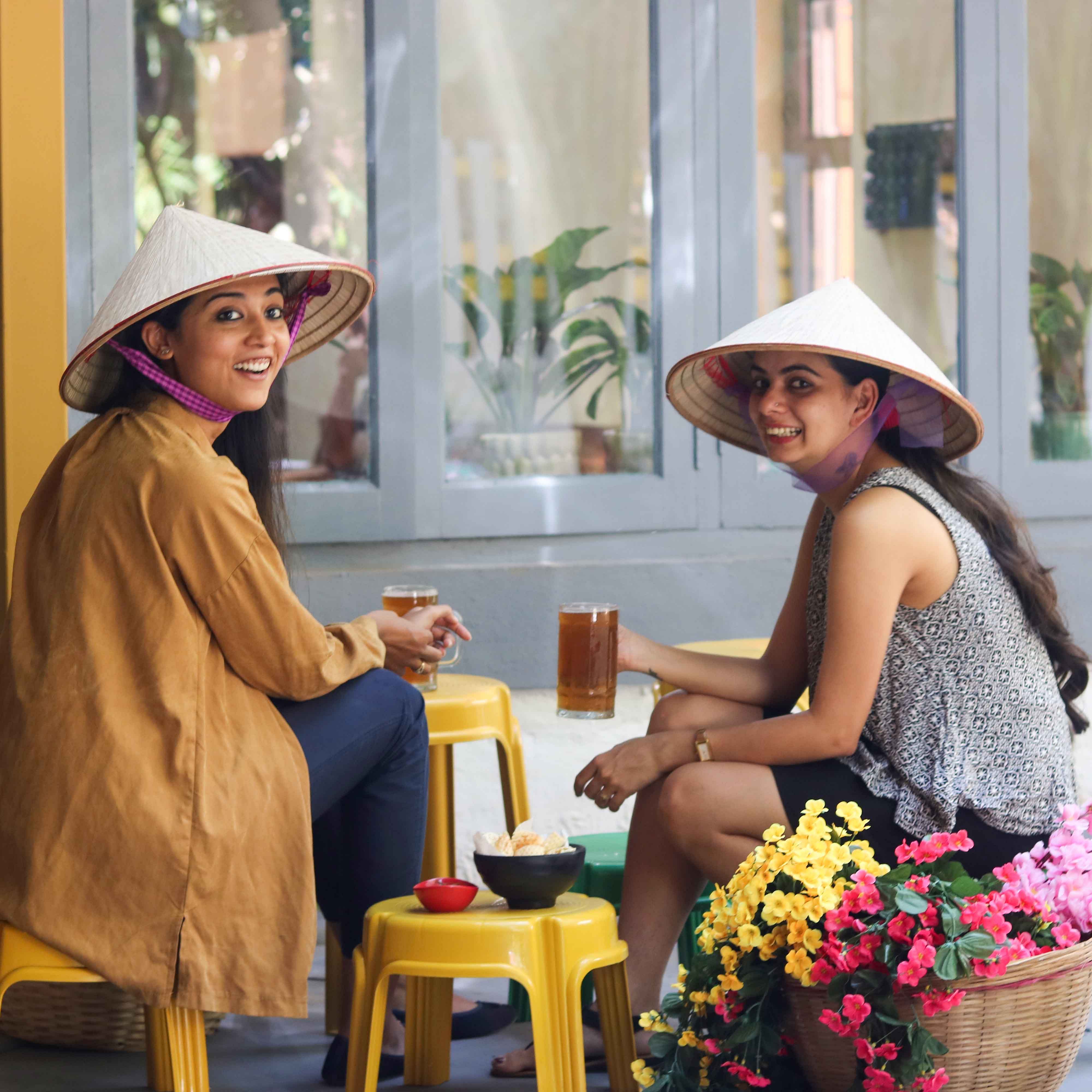 Yellow,Fun,Conversation,Sitting,Fashion accessory,Vacation,Happy