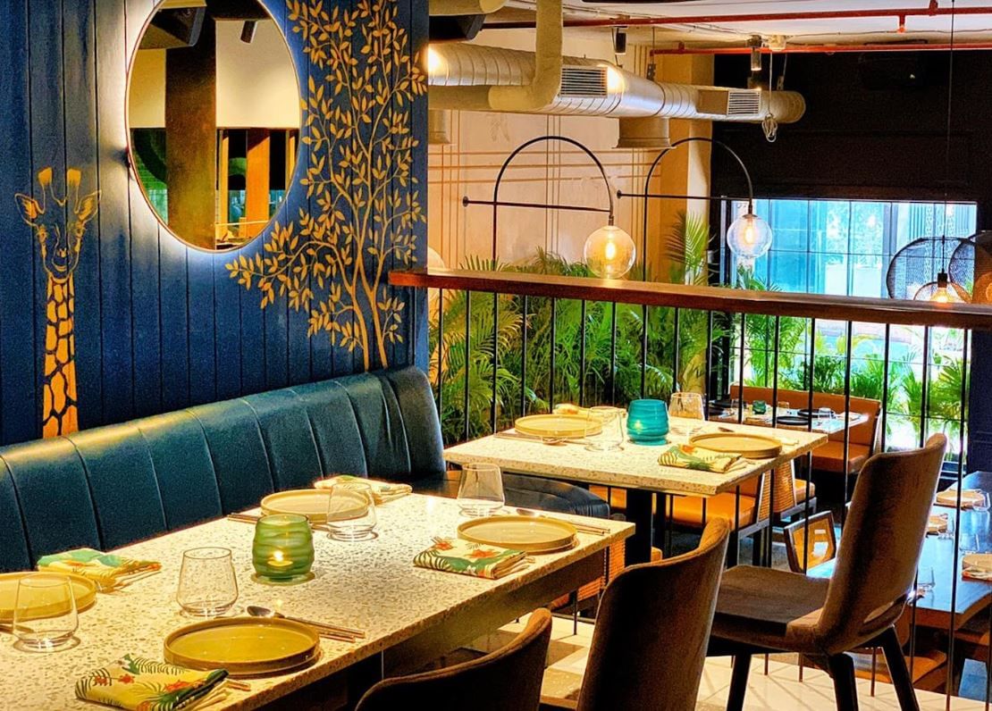 Restaurant,Room,Interior design,Table,Dining room,Building,Brunch,Furniture,Café,Tree