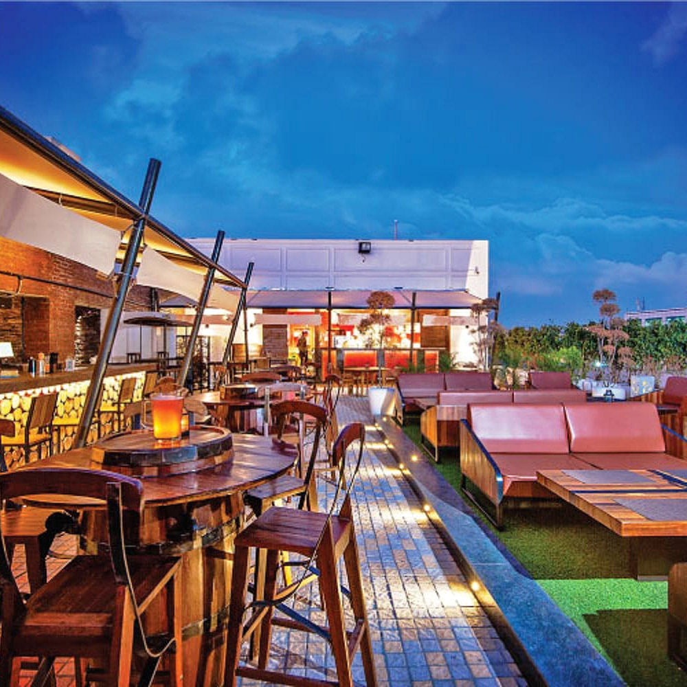 Sky,Restaurant,Building,Real estate,Atmosphere,Table,Cloud,Architecture,Home,Room