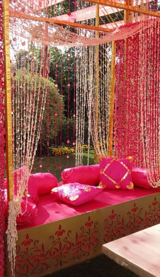 Pink,Decoration,Canopy bed,Room,Interior design,Curtain,Furniture,Textile,Chair,Magenta