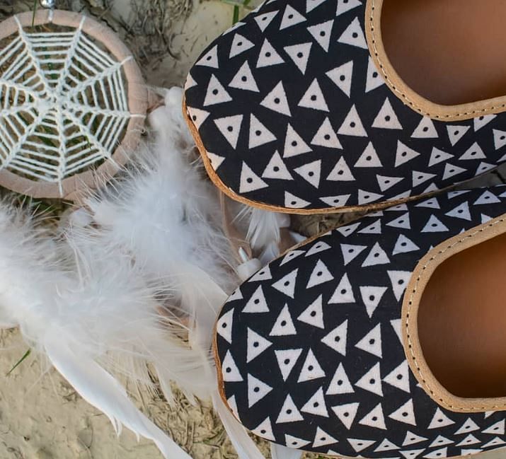 Footwear,Shoe,Feather,Pattern,Headgear,Design,Ear,Fur,Fashion accessory,Hat