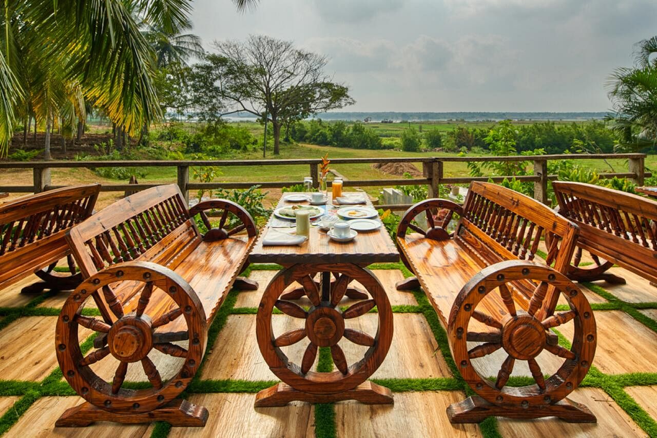 Property,Wagon,Vehicle,Estate,Tree,Landscape,Wood,Table,Wheel,Real estate