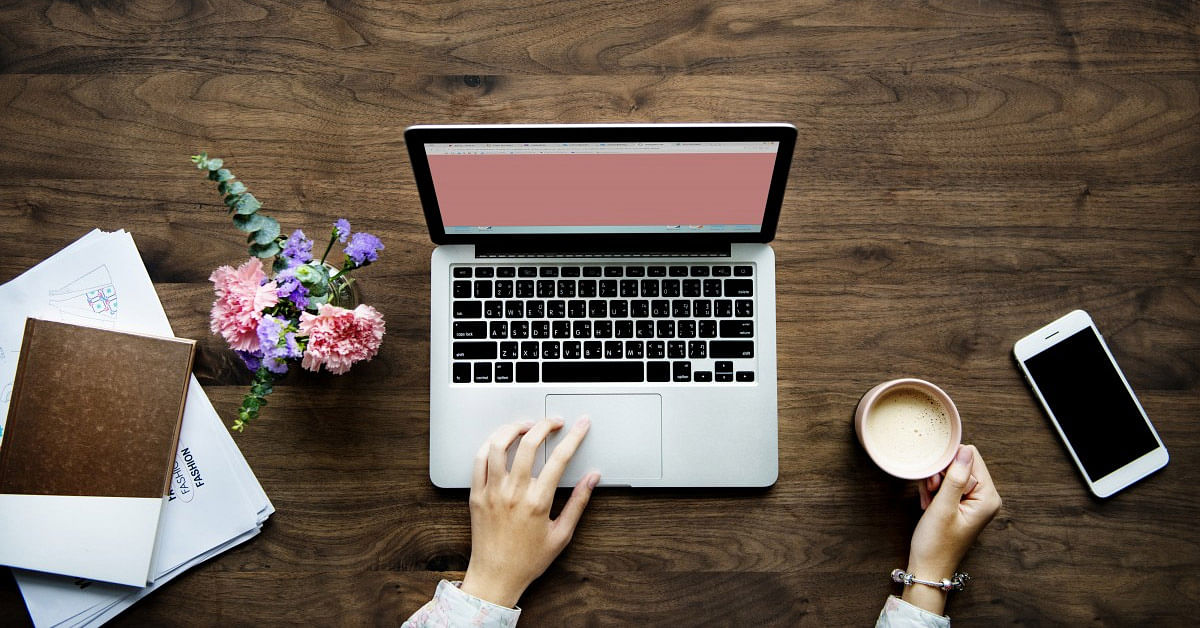 Laptop,Space bar,Desk,Computer keyboard,Technology,Electronic device,Netbook,Table,Hand,Font