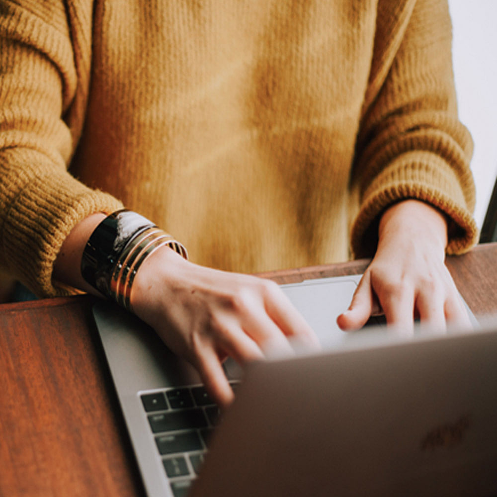 Hand,Finger,Typing,Technology,Laptop,Electronic device,Wrist,Photography,Nail,Desk