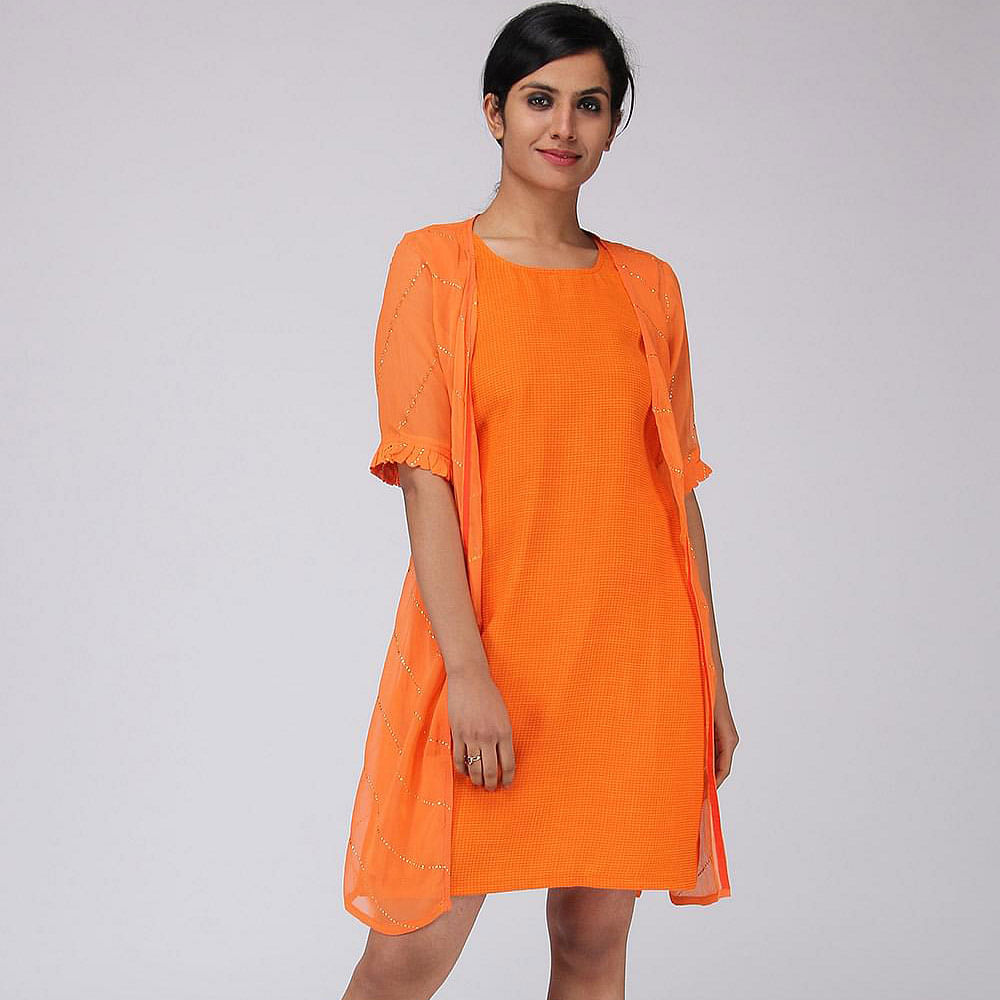 Clothing,Orange,Day dress,Dress,Fashion model,Shoulder,Sleeve,Neck,Peach,Yellow