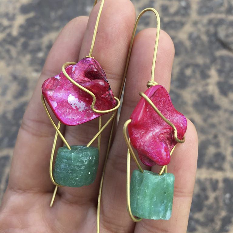 Pink,Magenta,Fashion accessory,Jewellery,Earrings,Hand,Nail,Finger,Ruby,Plant