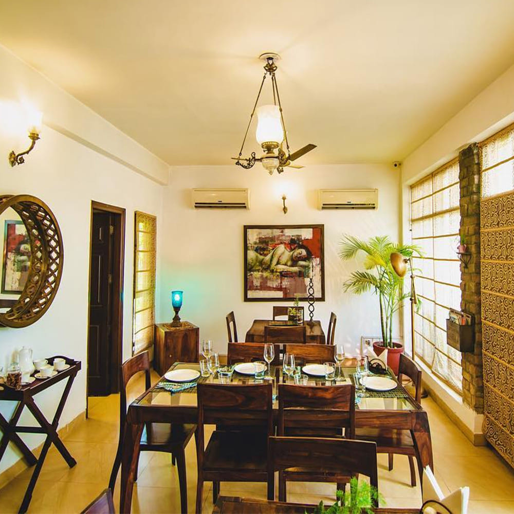 Room,Interior design,Dining room,Ceiling,Property,Furniture,Building,Chandelier,Table,Lighting