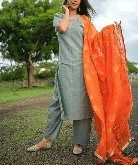 Clothing,Orange,Formal wear,Peach,Textile,Outerwear,Lawn,Linen,Silk,Photo shoot