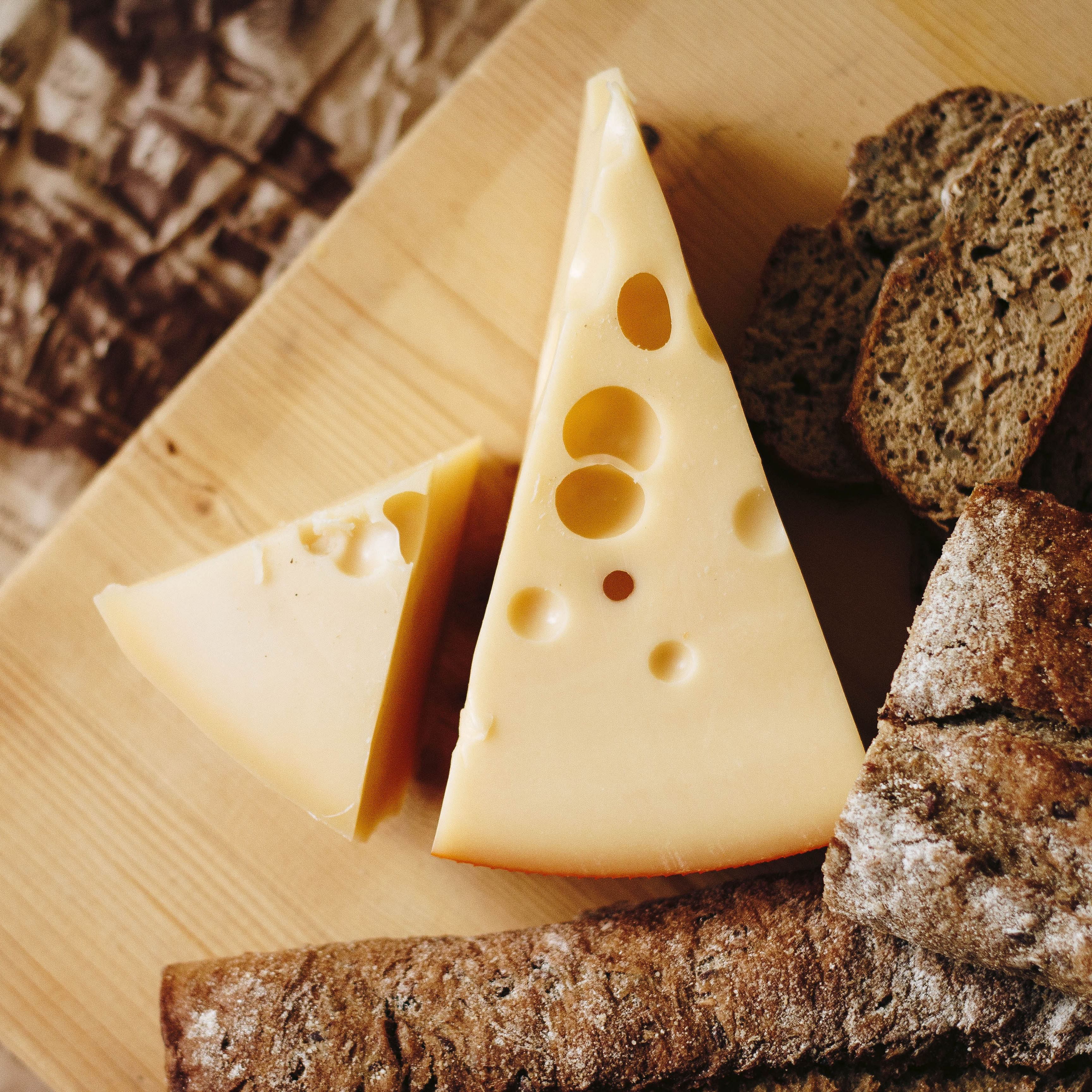 Food,Cheese,Dairy,Comfort food,Ingredient,Cuisine,Swiss cheese,Dish,Cone,Triangle