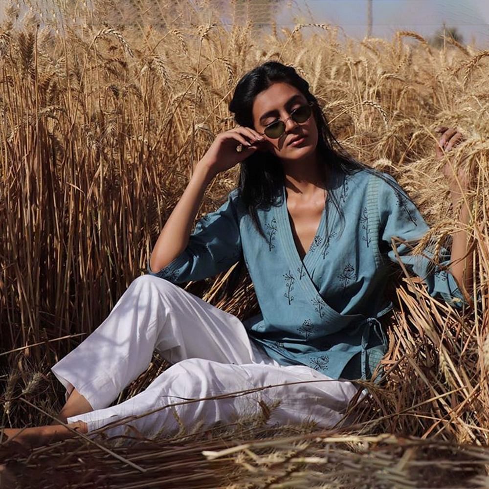 People in nature,Grass family,Sitting,Adaptation,Long hair,Crop,Photography,Straw,Plant,Grass