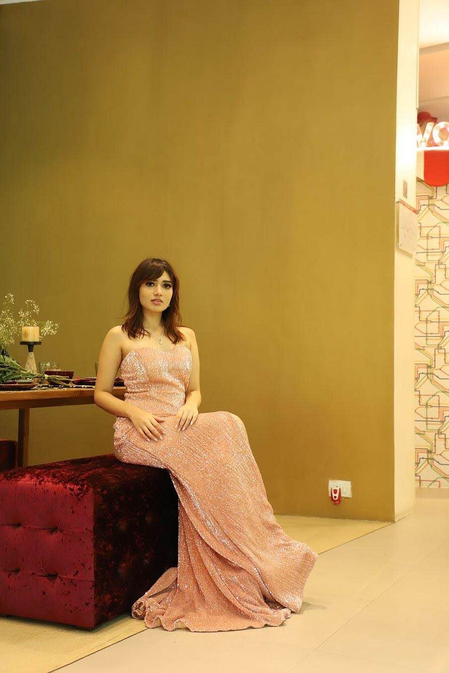 Dress,Skin,Shoulder,Beauty,Room,Sitting,Fashion,Gown,Long hair,Formal wear