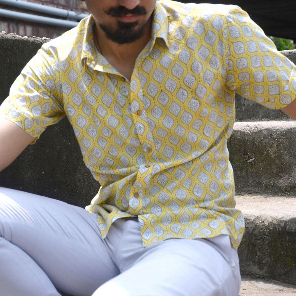 Yellow,Sitting,Design,Pattern,Sleeve,Outerwear,Dress shirt,Polka dot,Jeans