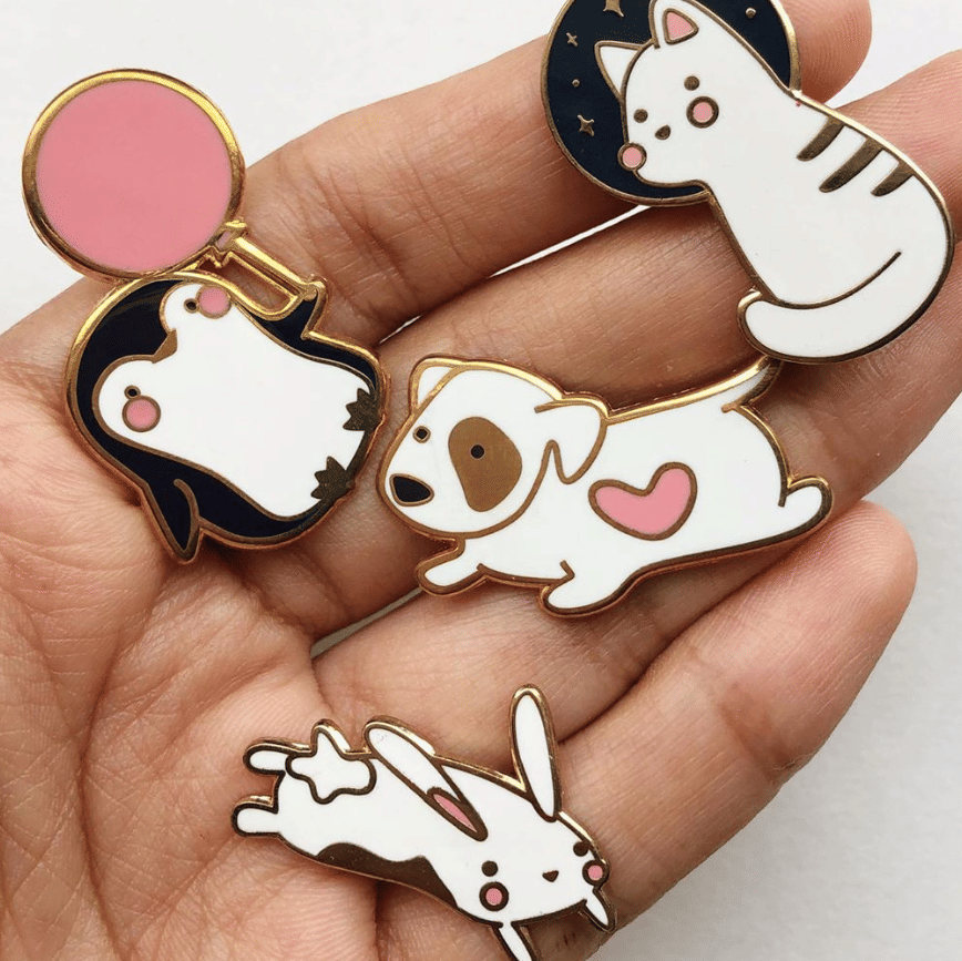 French bulldog,Hand,Fashion accessory,Skull,Fawn,Boston terrier,Puppy love,Canidae,Ear,Bone