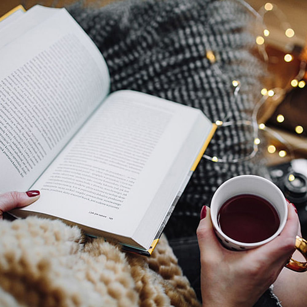 Coffee cup,Hand,Food,Snack,Cup,Cup,Book,Cuisine,Breakfast,Meal