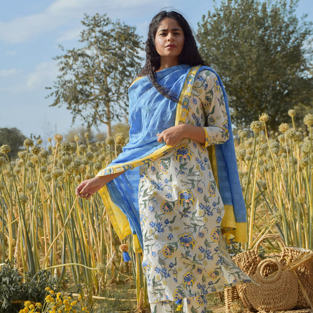 People in nature,Clothing,Yellow,Grass family,Plant,Textile,Outerwear,Field,Crop,Wheat