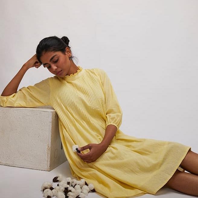 Yellow,Sitting,Textile,Leg,Neck,Furniture,Beige,Linens,Dress,Comfort