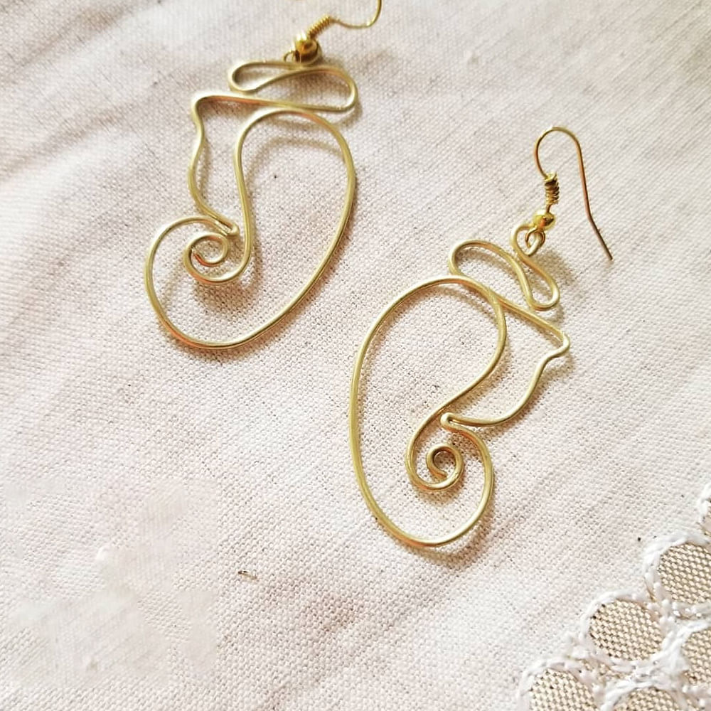 Earrings,Jewellery,Body jewelry,Fashion accessory,Metal,Ear,Brass