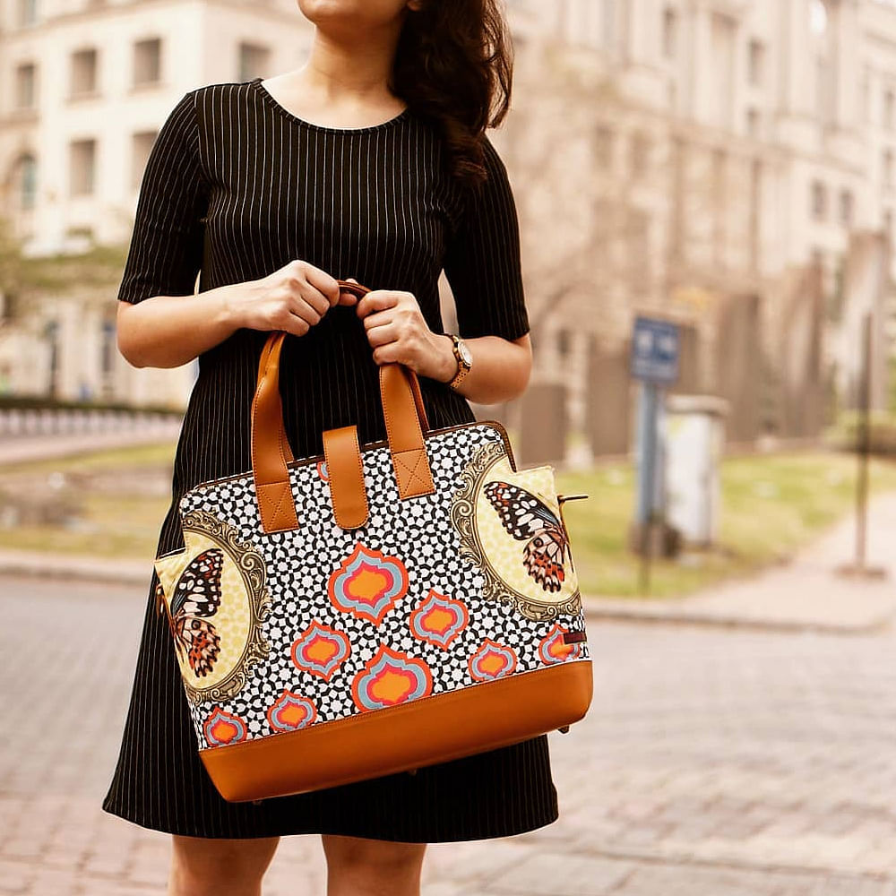 Bag,Shoulder,Handbag,Street fashion,Joint,Orange,Clothing,Fashion accessory,Yellow,Fashion