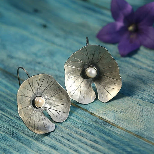 Fashion accessory,Jewellery,Petal,Earrings,Flower,Metal,Plant,Silver,Morning glory,Hydrangea