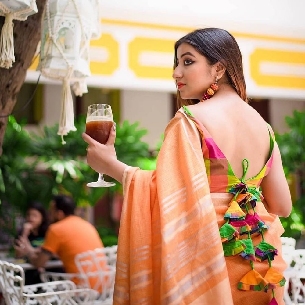 Clothing,Orange,Yellow,Formal wear,Peach,Textile,Neck,Photo shoot,Dress,Photography